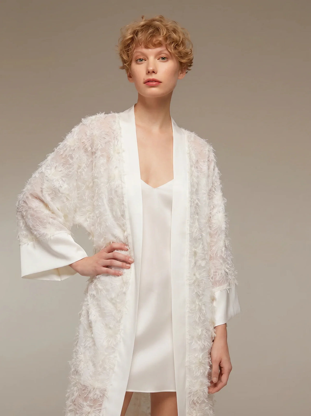 Ivory satin robe and nightgown folded in tissue paper with a ribbon — how to gift lingerie without knowing her size in the UAE