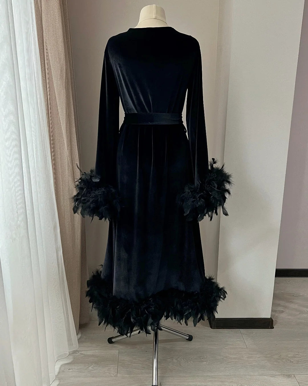 Black velvet feather robe detail
