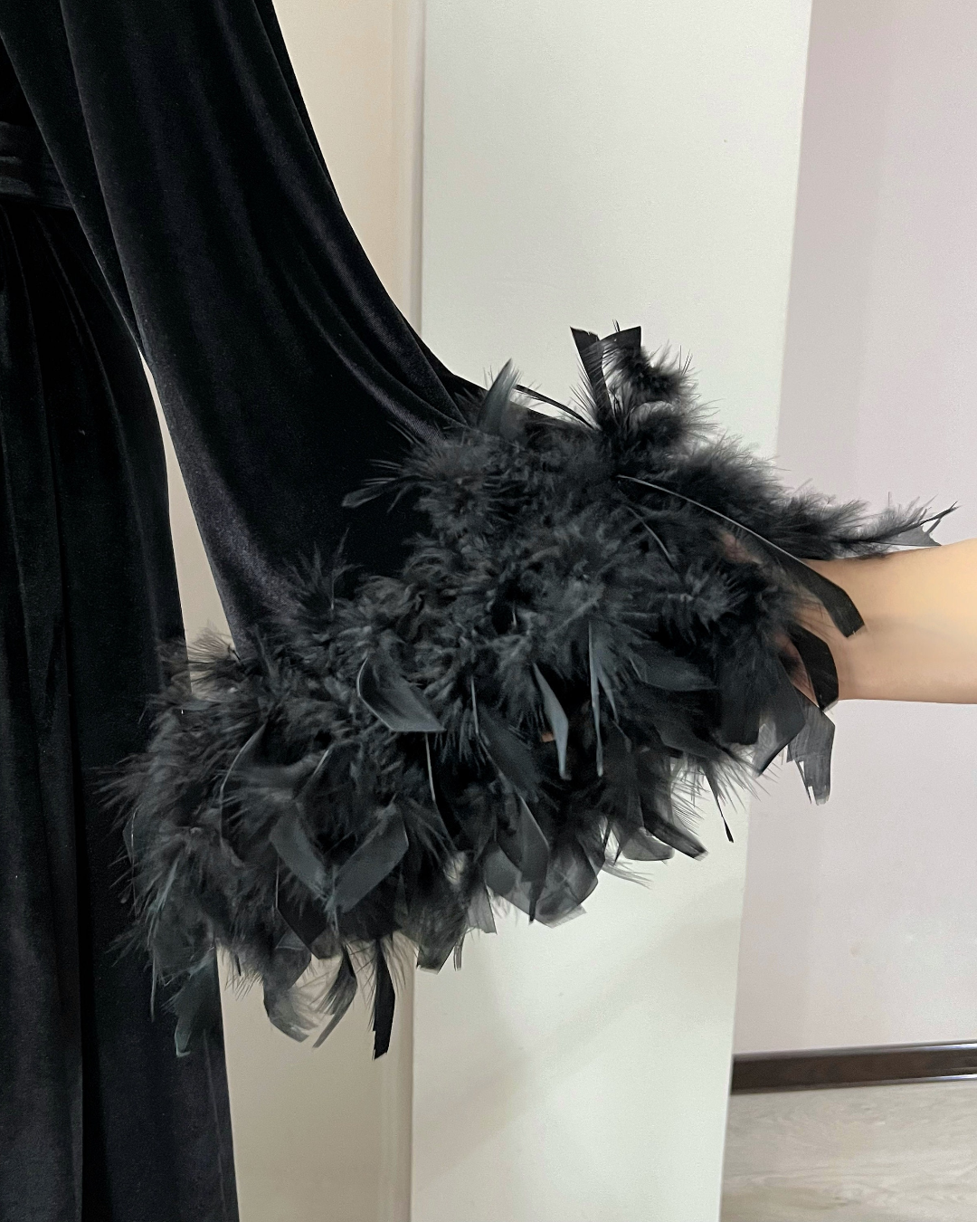 Black velvet feather robe styling