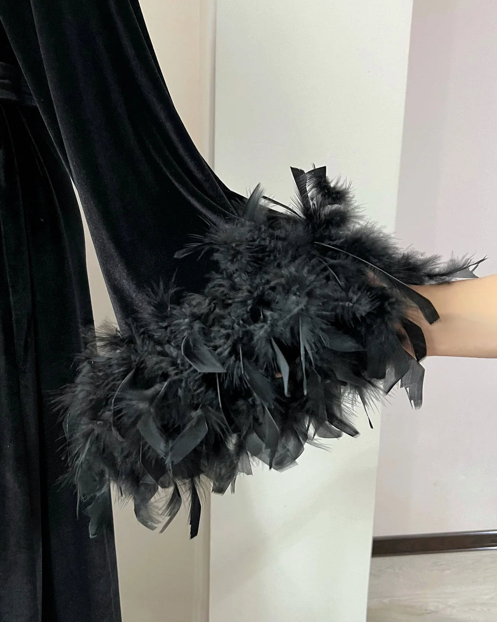 Black velvet feather robe styling