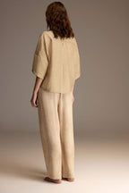 Woman wearing a beige Tencel knit top with matching patterned lounge trousers — Belle Bonjour BM-1912