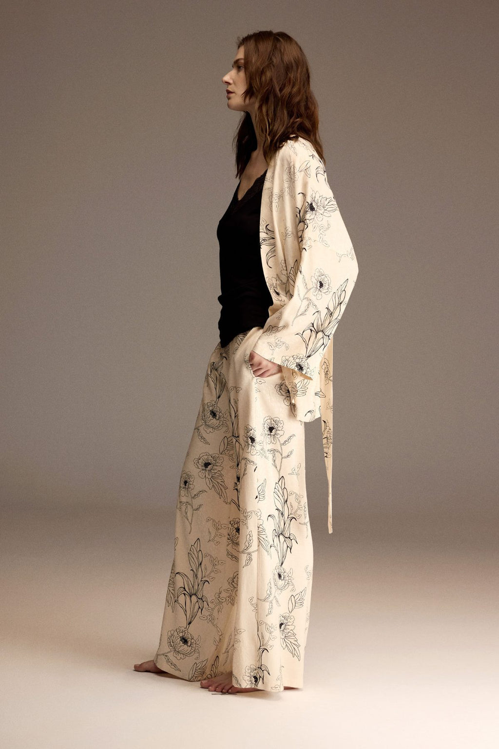 Woman wearing an ivory floral jacquard robe with matching wide-leg trousers — Belle Bonjour BM-1954
