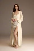 Woman wearing a long white satin bridal nightgown with side slit — Belle Bonjour BM-1958