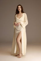 Woman wearing a long white satin bridal nightgown with side slit — Belle Bonjour BM-1958