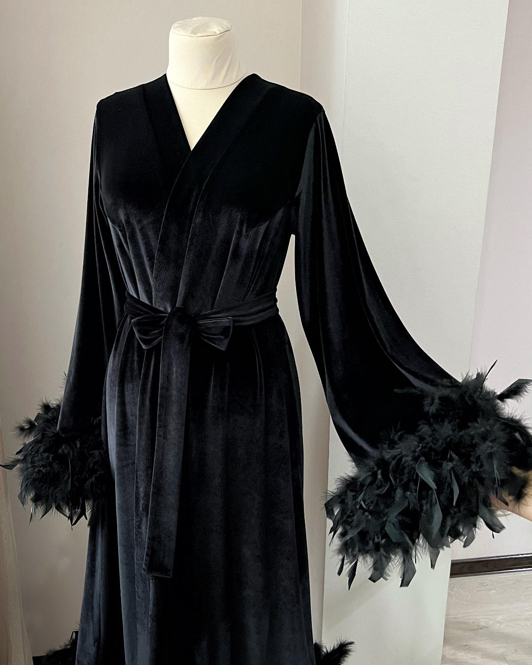 Black velvet robe with feather trim