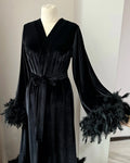 Black velvet robe with feather trim